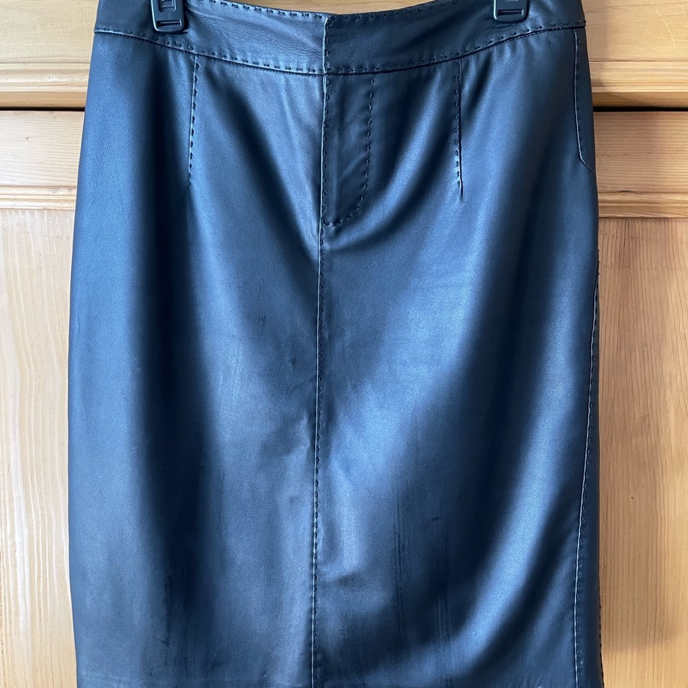 Victoria’s Secret knee length black leather skirt.